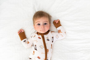 Cozy Bedtime Buckaroo Zipper Lounger for babies, shown from angle 2, perfect for comfy loungewear.