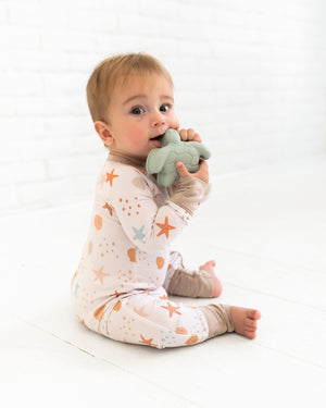 Sandy Toes Zipper Lounger for babies in soft fabric, perfect for cozy lounging and playtime.