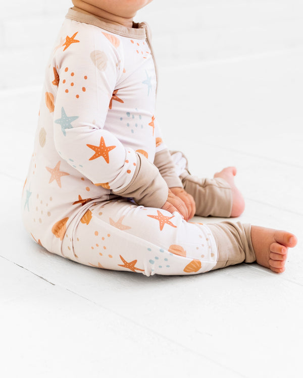 Sandy Toes Zipper Lounger for babies, cozy loungewear in a stylish design, viewed from angle 3.