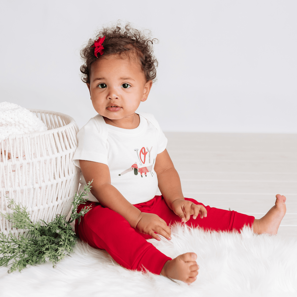Joy dog graphic bodysuit for babies, short sleeve design, perfect for comfort and style.