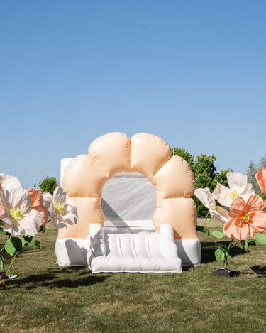 Mini Daisy Peach Flower Bounce House for outdoor play, perfect for toddlers and kids' fun activities.