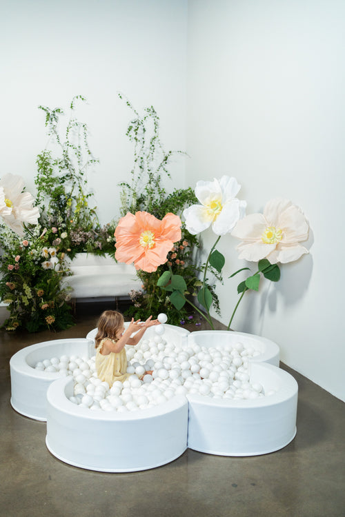 Mini Daisy Ball Pit in playful colors, perfect for baby playtime and enhancing any nursery decor.