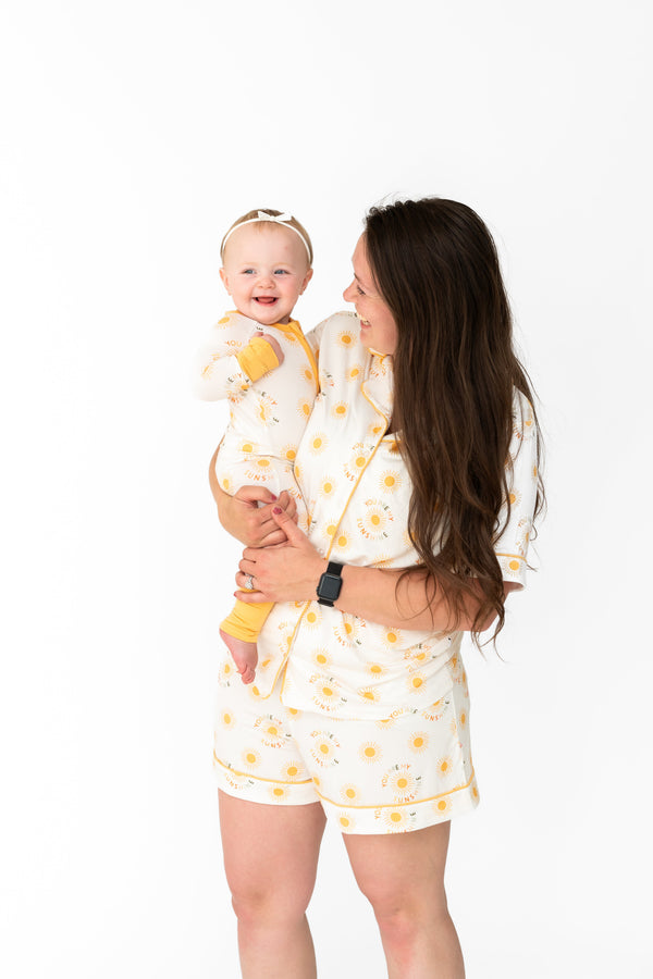 You Are My Sunshine Zipper Lounger for babies in cozy loungewear, angle view showcasing soft fabric and cheerful design.