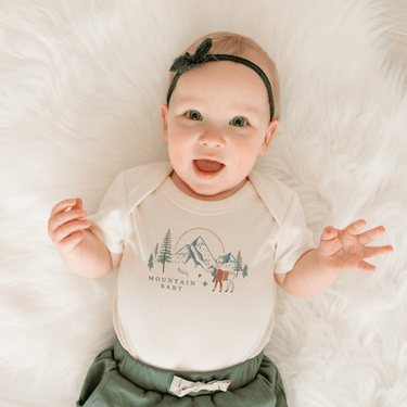 "Mountain-themed graphic bodysuit for babies, short sleeve design, perfect for outdoor adventures."
