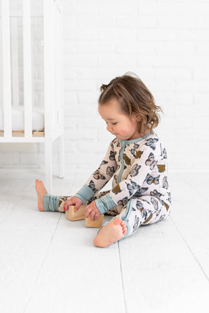 Social Butterfly Zipper Lounger for babies - cozy loungewear with a fun design, perfect for relaxation and playtime.