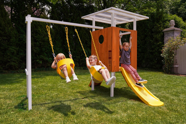 Compact wooden toddler swing set for outdoor play, perfect for babies and kids in a forest setting.