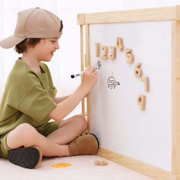 Wooden baby playpen with mirror and whiteboard panel, foldable 63"x63", Montessori sensory play yard, angle view.