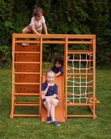 Magnolia 7-in-1 Real Wood Playset for kids, perfect for indoor and outdoor climbing fun.