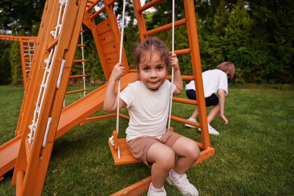 Magnolia 7-in-1 Real Wood Playset for kids, perfect for indoor and outdoor climbing fun.
