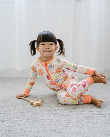 Cozy Donut Mind If I Do Zipper Lounger for babies in soft fabric, perfect for lounging and playtime.