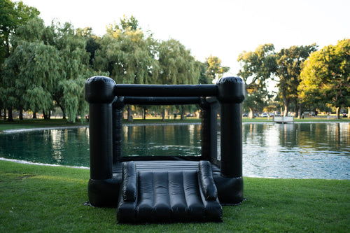 Mini Luna Black Bounce House for outdoor playsets, perfect for kids' fun and active playtime.