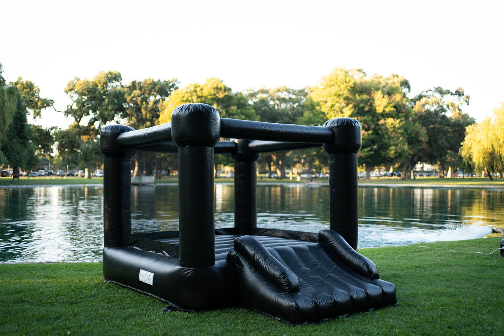 Mini Luna Black Bounce House for outdoor playsets, perfect for kids' fun and active playtime.