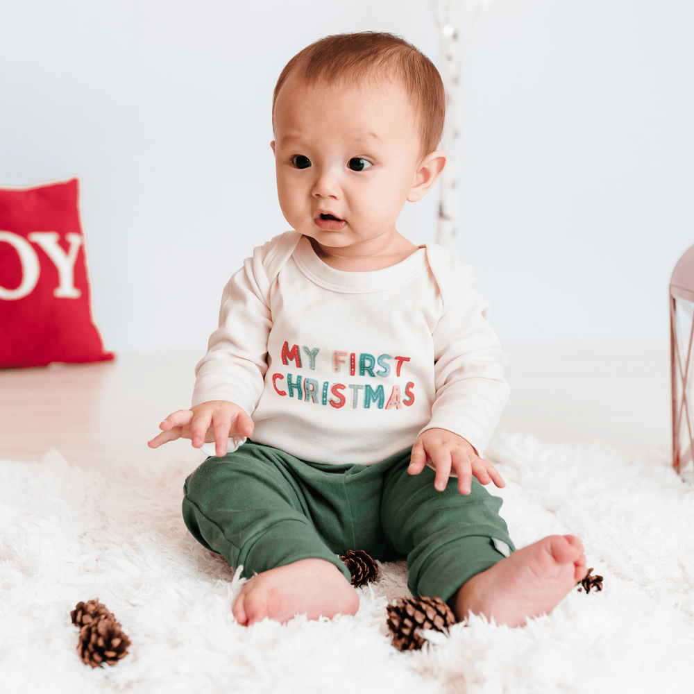 Long sleeve graphic bodysuit for babies, "My First Christmas," perfect for festive celebrations.