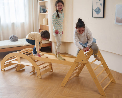 Bazel 6-in-1 Pikler Climber Set for toddlers: wooden triangle, rocker arch, and slide, perfect for indoor play.