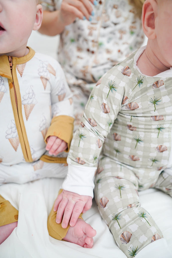 Sage Sands Bamboo Sleeper for babies, soft and breathable pajamas in a stylish design, angle view.