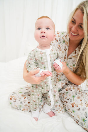 Sage Sands Bamboo Sleeper for babies, soft and cozy pajamas in a stylish design, angle view.