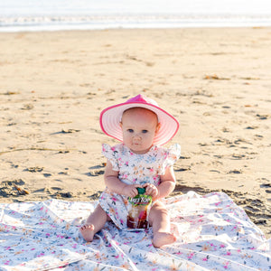 Pastel Floral Flutter Bapron for babies, angled view showcasing vibrant design and practical bib features.