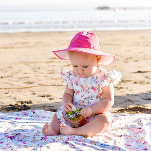 Pastel Floral Flutter Bapron for babies, angled view showcasing its vibrant design and practical features.