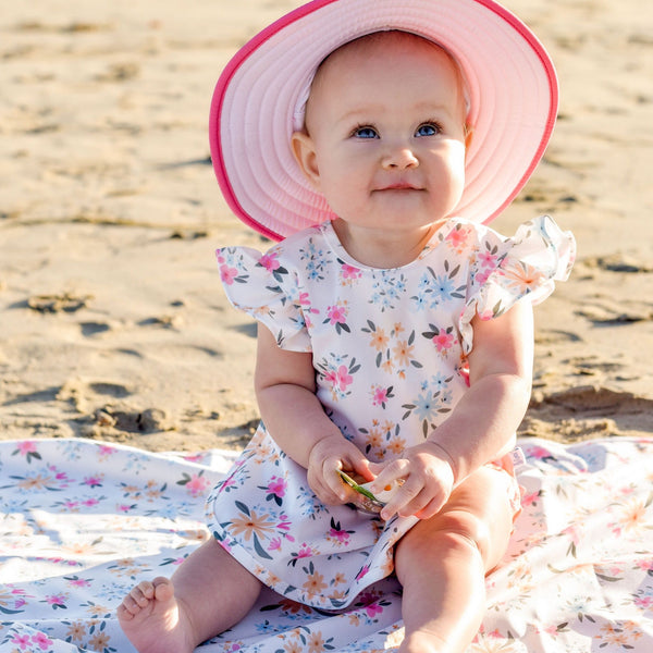 Pastel Floral Flutter Bapron for babies, angle view showcasing vibrant design and practical features.