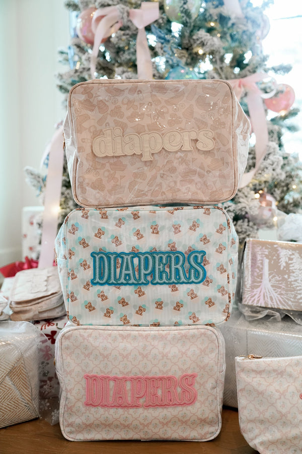 XL Diapers in a clear coat travel bag, angled view showcasing convenience and portability for parents on the go.