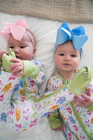 Bamboo sleeper pajamas for babies in a cute bikini design, angle view showcasing softness and comfort.