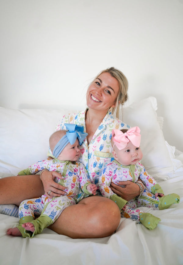 Bamboo sleeper pajamas for babies in a cute bikini design, angle view showcasing soft fabric and vibrant colors.