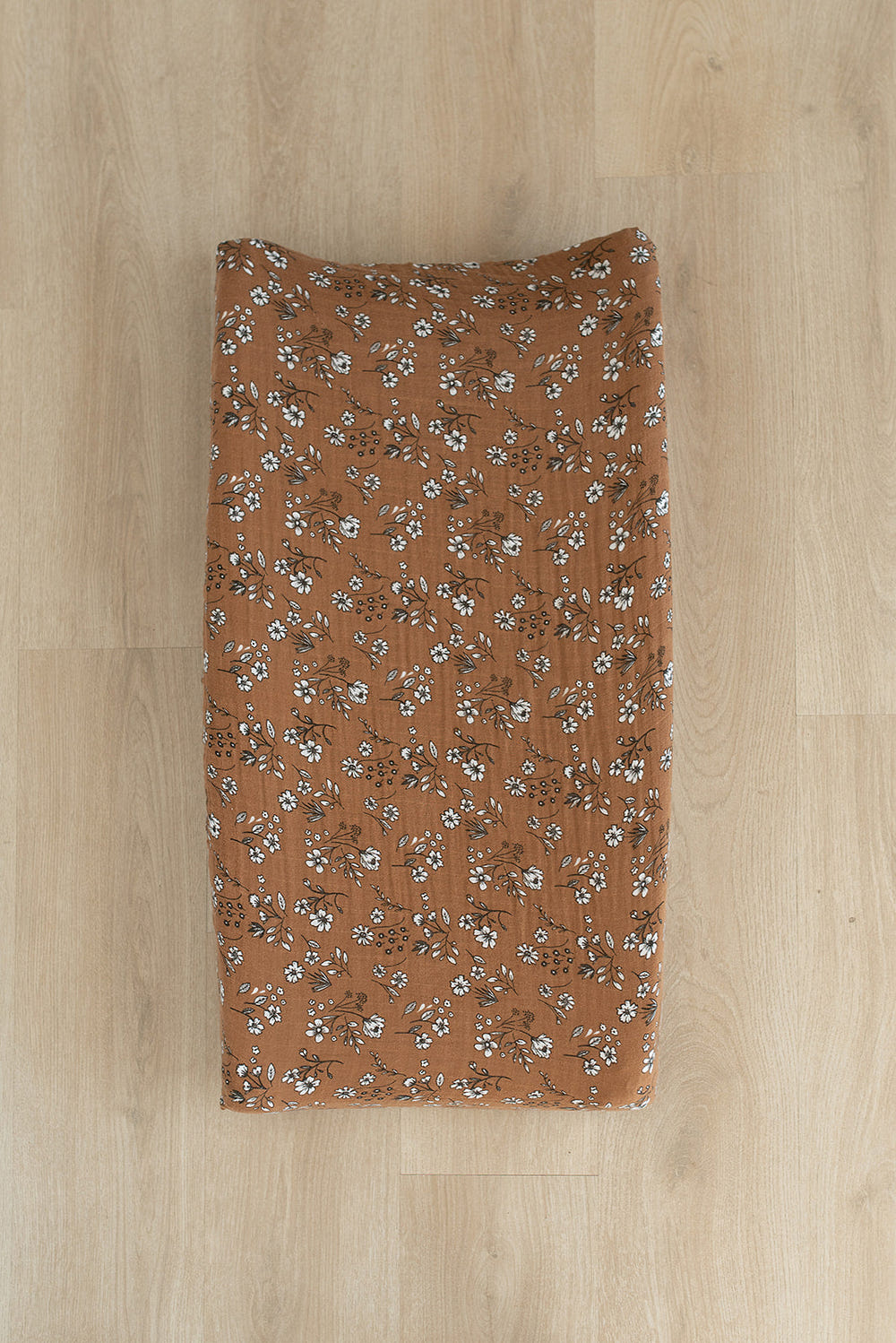 Vintage floral muslin changing pad cover for babies, perfect for stylish and comfortable diaper changes.