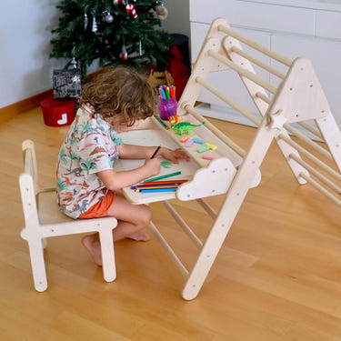 Versatile Montessori climbing set with folding table and chair for toddlers, promoting active play and learning.