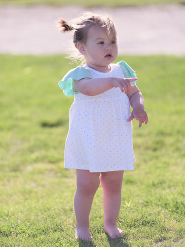 Organic cotton Alice ruffled dress in polka dot design for babies and toddlers. Perfect for stylish and comfortable wear.