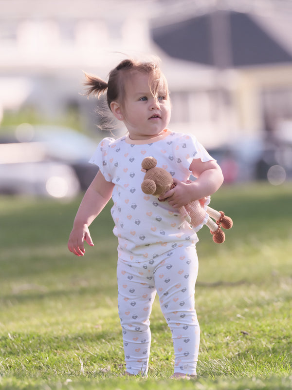 Organic cotton leggings in Love Lock design, angled view showcasing softness and style for babies.