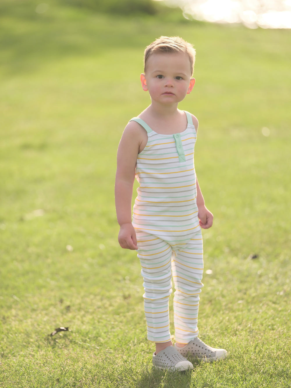 Organic cotton striped overall for babies, soft and comfortable for everyday wear.