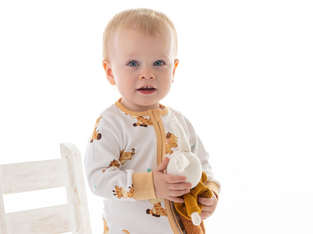 Organic cotton romper featuring animal prints for babies, perfect for comfort and style in the Animal Kingdom collection.