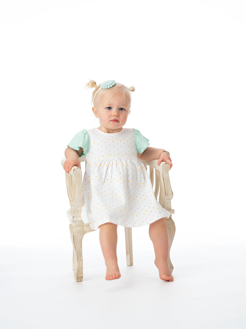 Organic cotton Alice ruffled dress in polka dot design for babies and toddlers. Perfect for stylish and comfortable wear.
