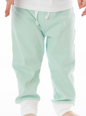 Organic cotton jogger pants in mint green for babies, soft and stylish for comfortable playtime.
