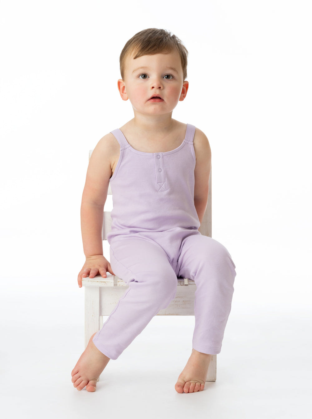 Organic cotton lavender overall for babies, soft and eco-friendly, perfect for comfortable playtime.