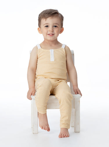 Organic cotton overall in butter gingham pattern for babies, soft and stylish for everyday wear.