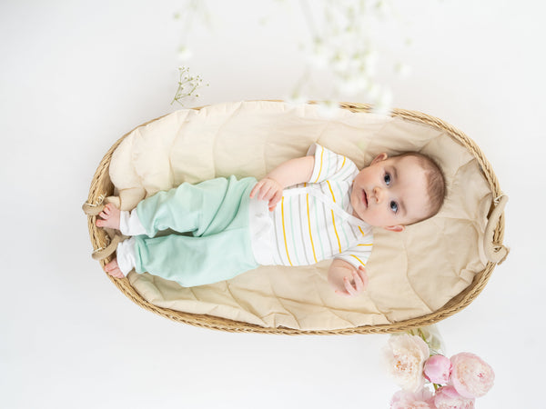 Mint green organic cotton jogger pants for babies, angle view showcasing soft fabric and comfortable fit.