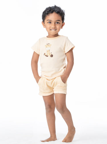 Organic cotton baby shorts in butter gingham pattern, perfect for comfort and style.