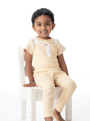Organic cotton overall in butter gingham, angle 3 view, perfect for stylish and comfortable baby outfits.