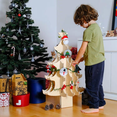 Montessori wooden Christmas tree with colorful felt ornaments for kids' holiday decor.