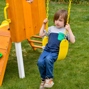 Compact wooden toddler swing set in a forest setting, perfect for outdoor play for babies and kids.