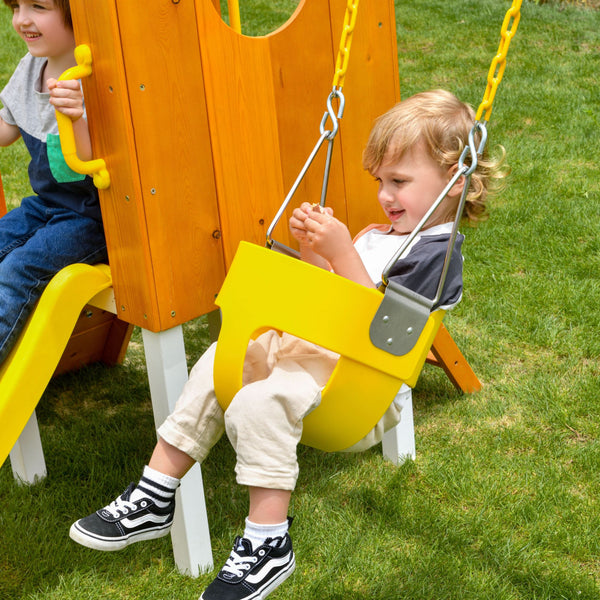 Compact wooden toddler swing set for outdoor play, perfect for babies and kids in a forest setting.