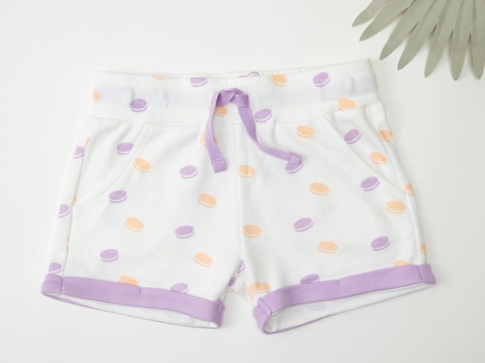 Organic cotton shorts for babies in a colorful macarons design, perfect for comfort and style.