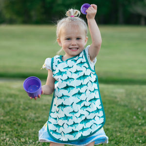 Shark Attack Bapron for babies, playful design, angle view, perfect for mealtime messes.