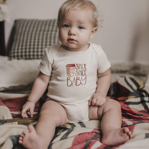 Spice Spice Baby graphic bodysuit for infants, short sleeve, stylish design, angle view showcasing vibrant colors.