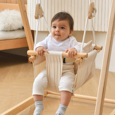 Baby swing for indoor playsets, perfect for keeping your little one entertained and safe while playing indoors.