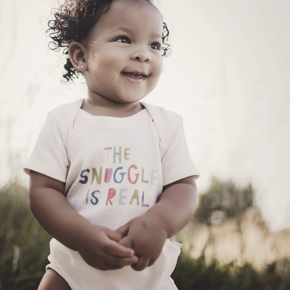 Snuggle graphic short sleeve bodysuit for babies, featuring a cute design and soft fabric.