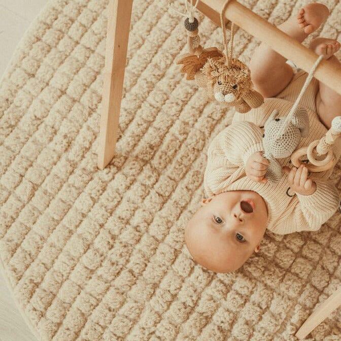 Handmade crochet safari toys for baby gym, perfect for playful and safe infant exploration.
