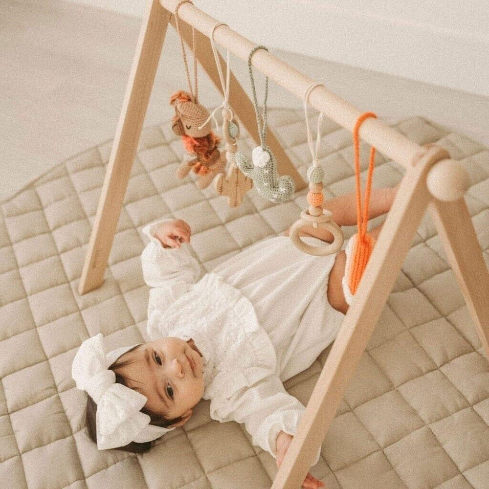 Handmade crochet toys for baby gym in boho desert style, perfect for stimulating play and development.