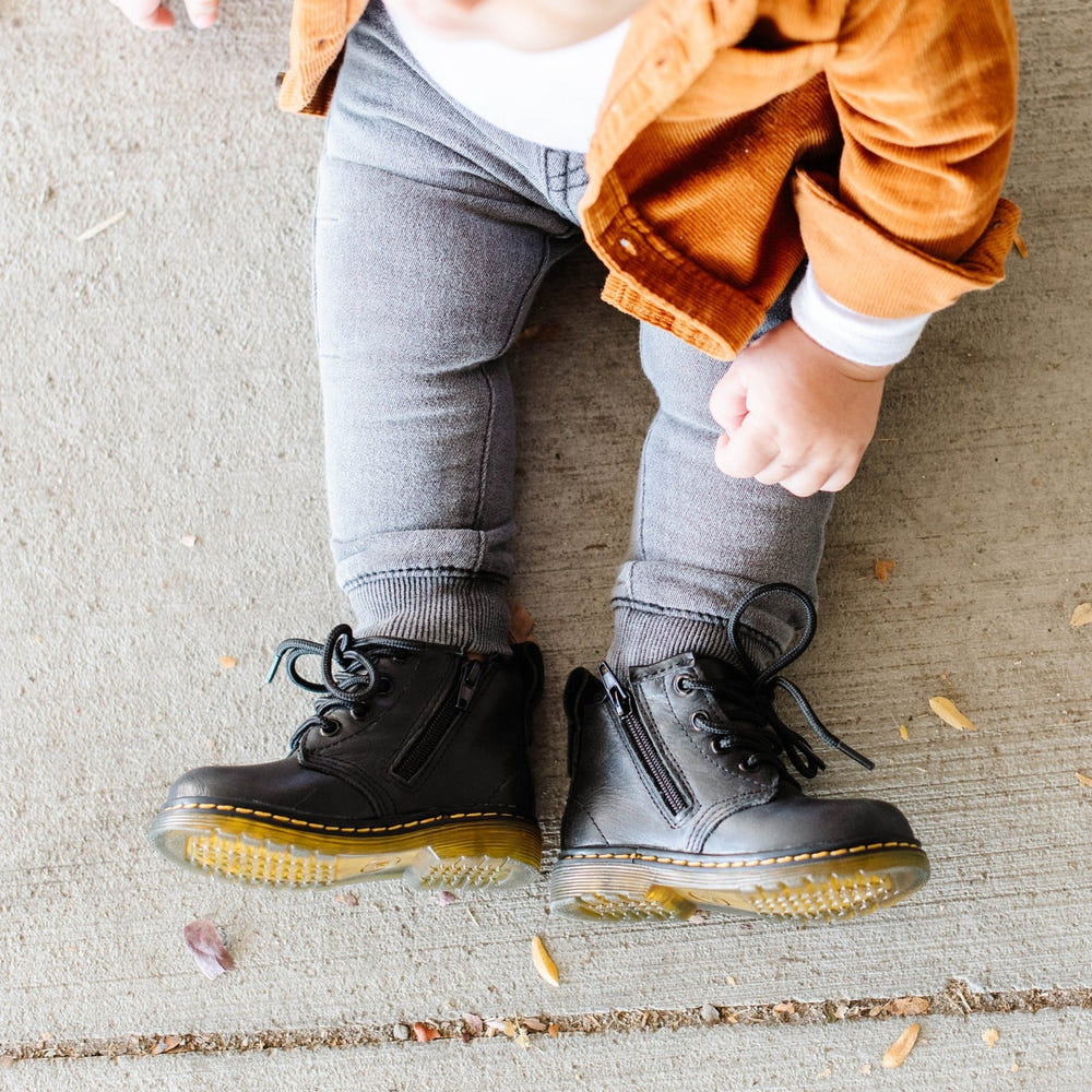 Black combat boots for babies, stylish and durable footwear for little adventurers.
